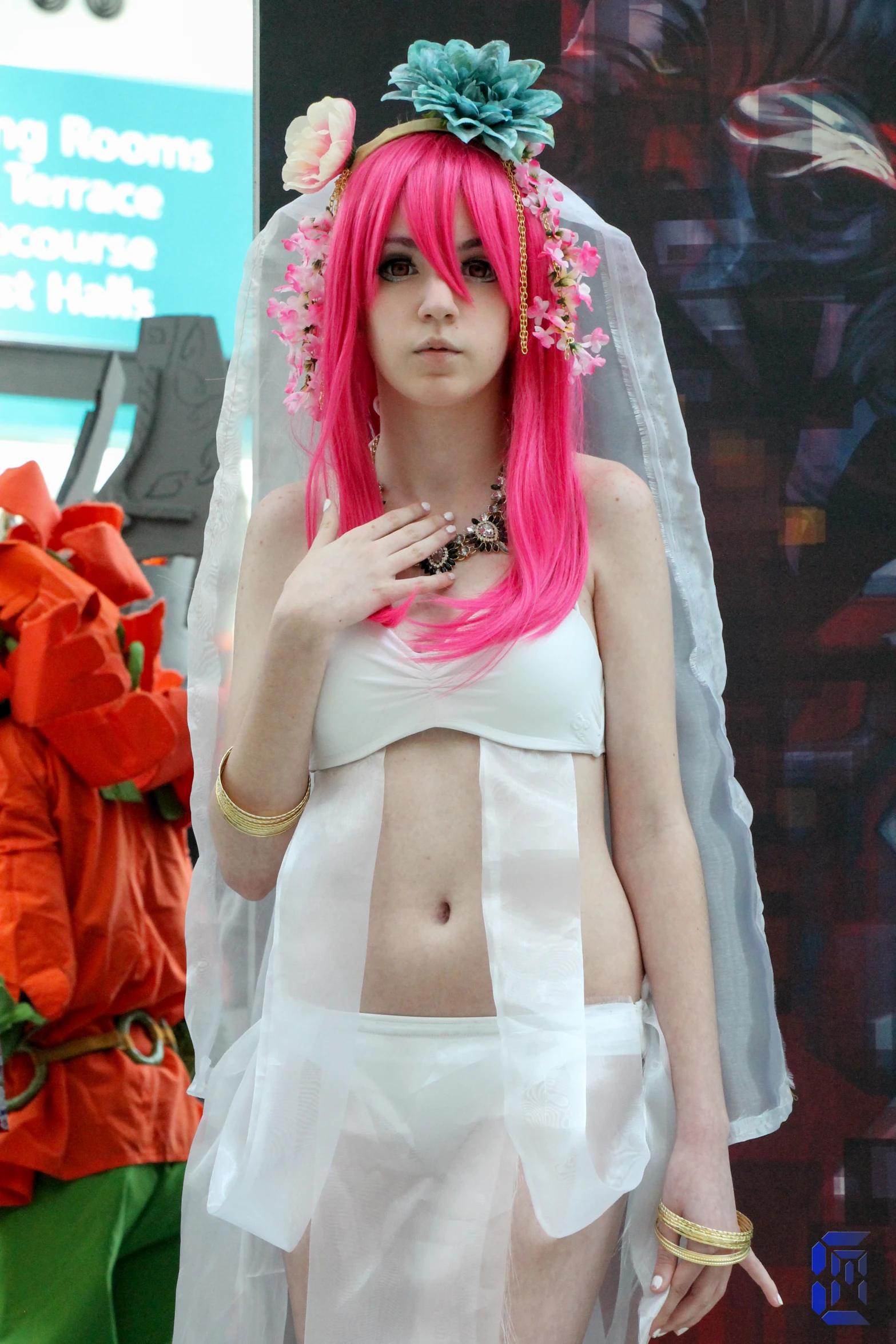 a young lady with pink hair and colorful makeup