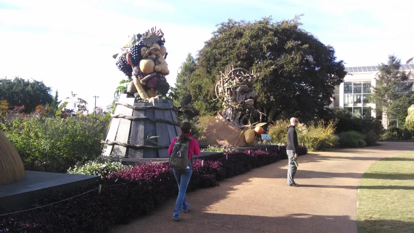 a statue of a dragon in the middle of a park