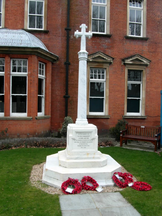 there is a monument and wreath near the window