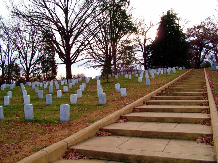 a large cemetery with the names of two different graves and a few headstones