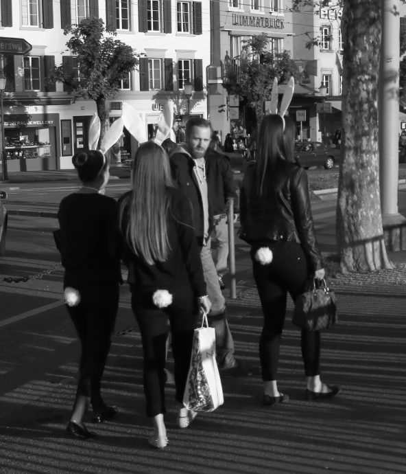 people walking in an area where buildings are visible