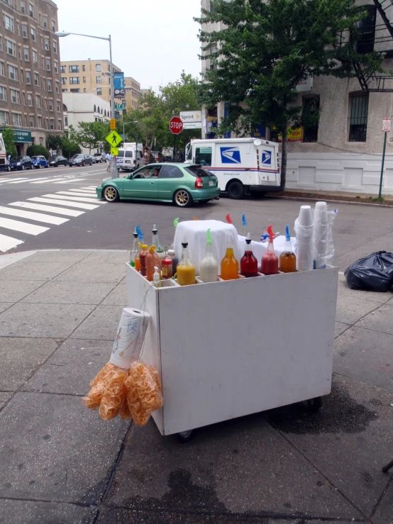 there is a soda display on the side of the street