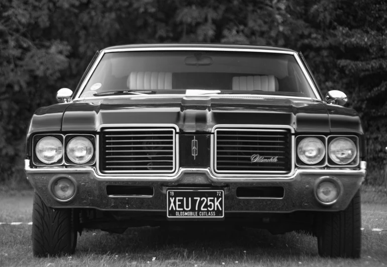 a black and white po of a car on the ground