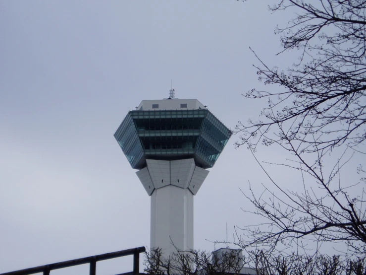 a tall tower sitting in the middle of a wintery day