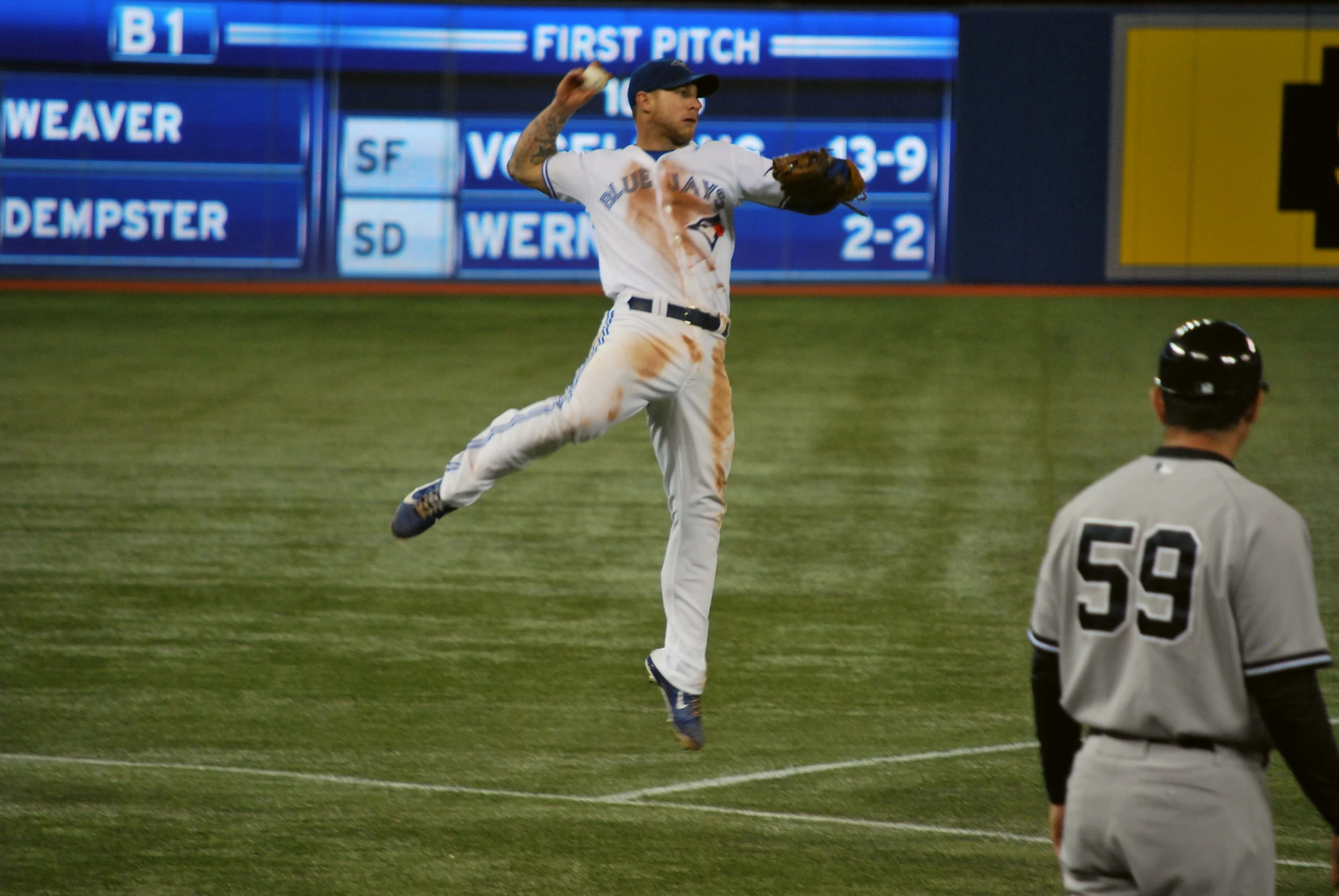 man in air after pitch at major league game