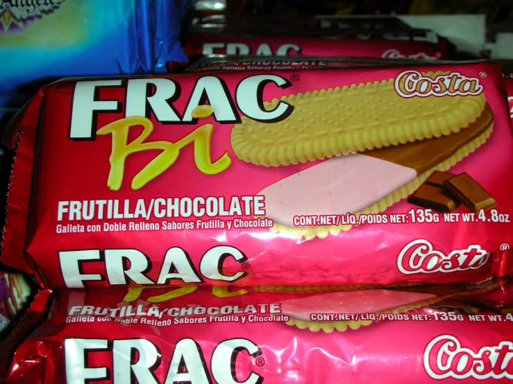 two packs of frac pq and chocolate coated biscuits