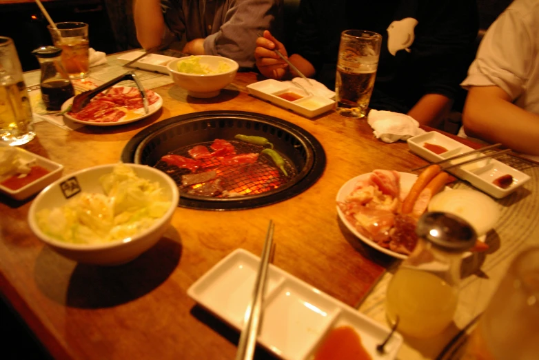 a table with several plates and glasses of food