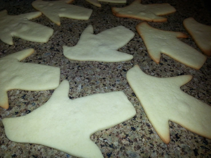 some cut out cookies with dough over them
