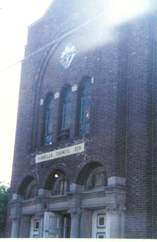 a red brick building has a large clock on it