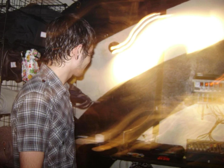 a man standing in front of a large tv