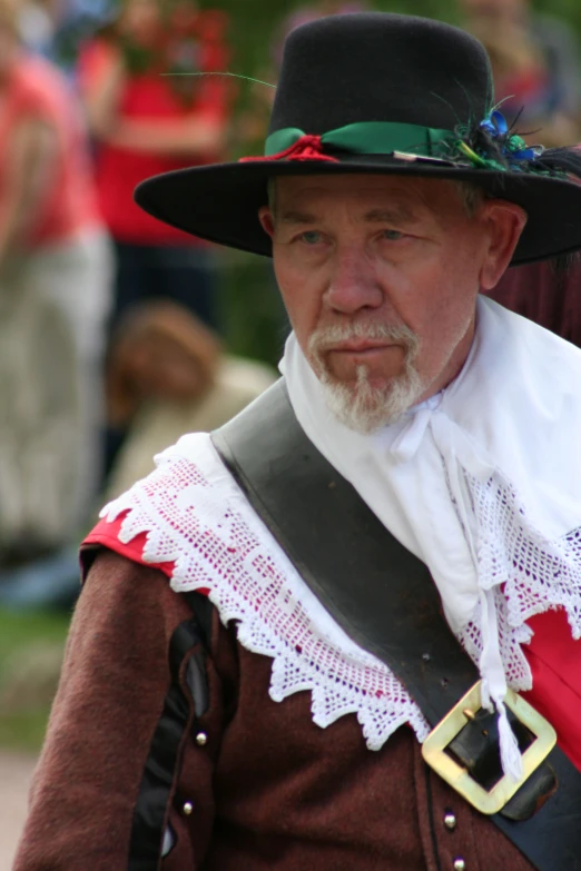 an older man is dressed up in pirate garb