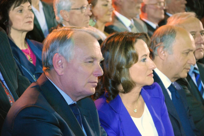 people attending at a meeting waiting for the event