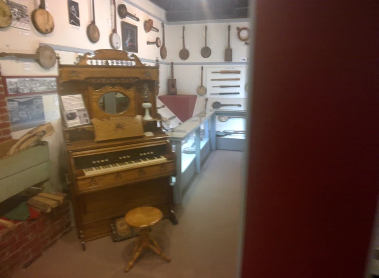 there is a music store with many musical instruments on the wall