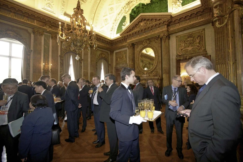 a group of men standing in front of a wooden floor