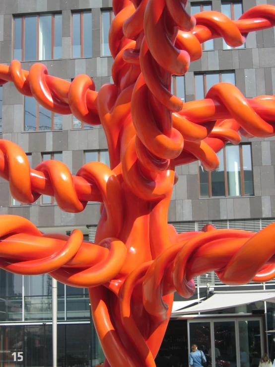 many orange objects in front of a building