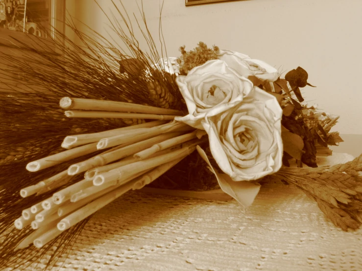 an assortment of flowers and leaves are arranged on a table