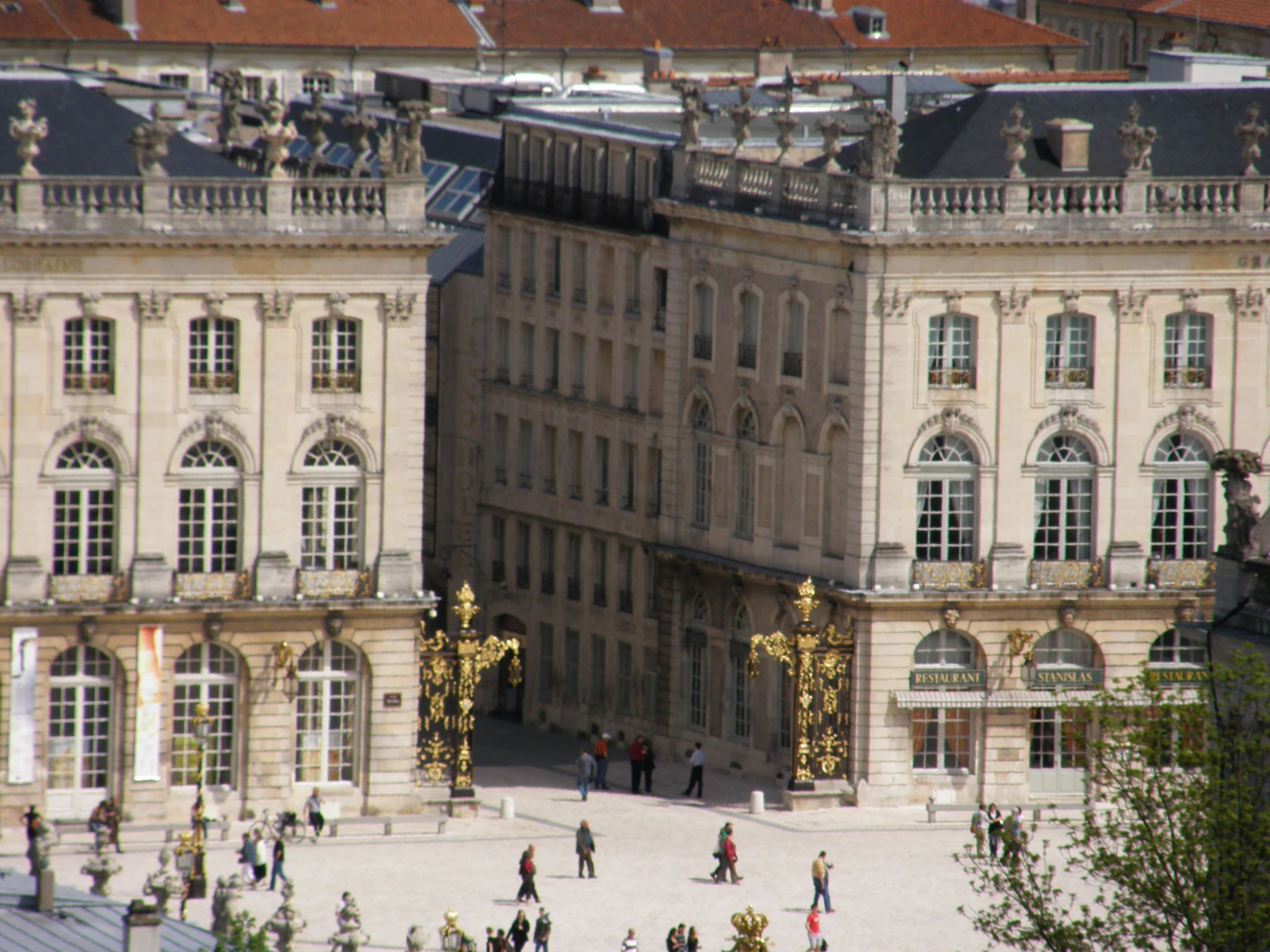 a building with statues of people standing around and in the middle of it