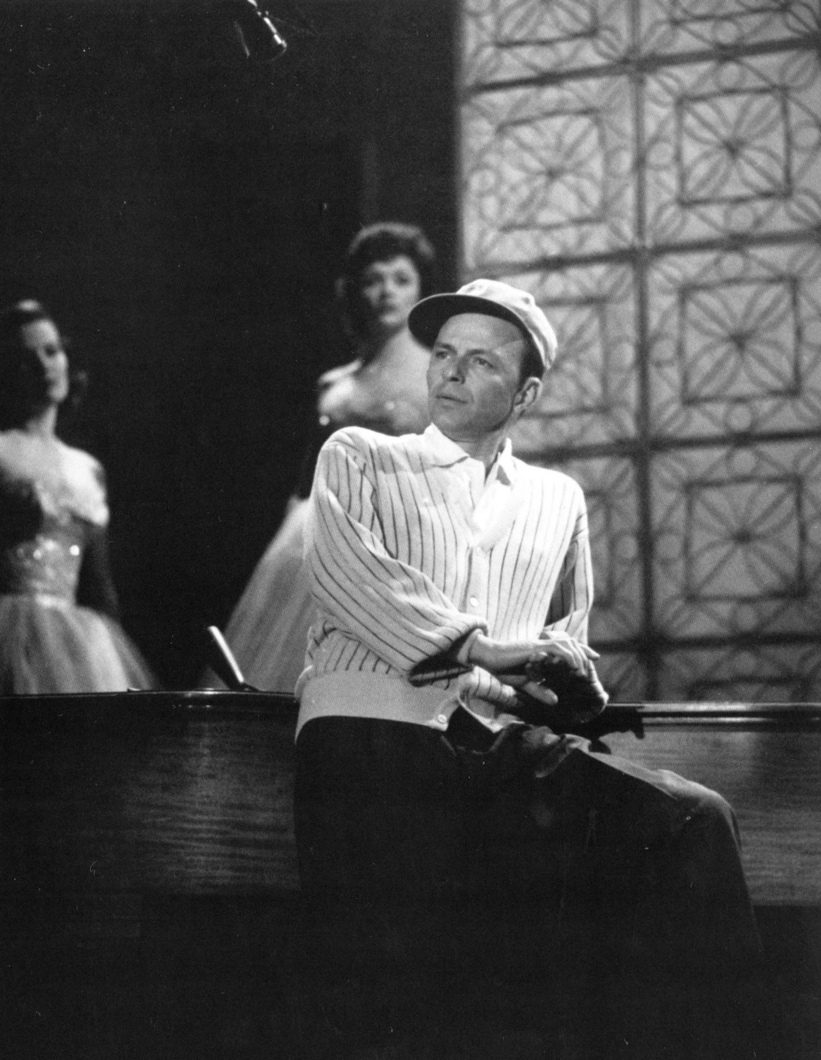 a man that is sitting down with his hands on a piano