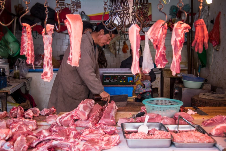 the meat is hanging on hooks in the kitchen