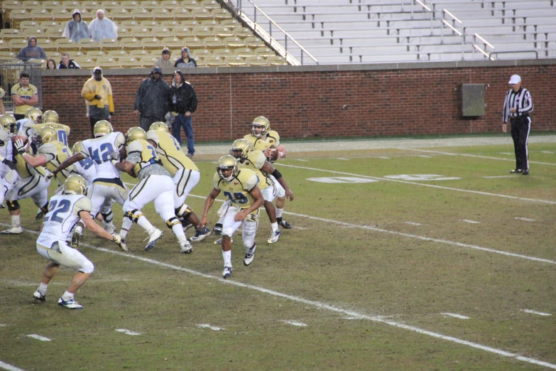 football players during the game are in action