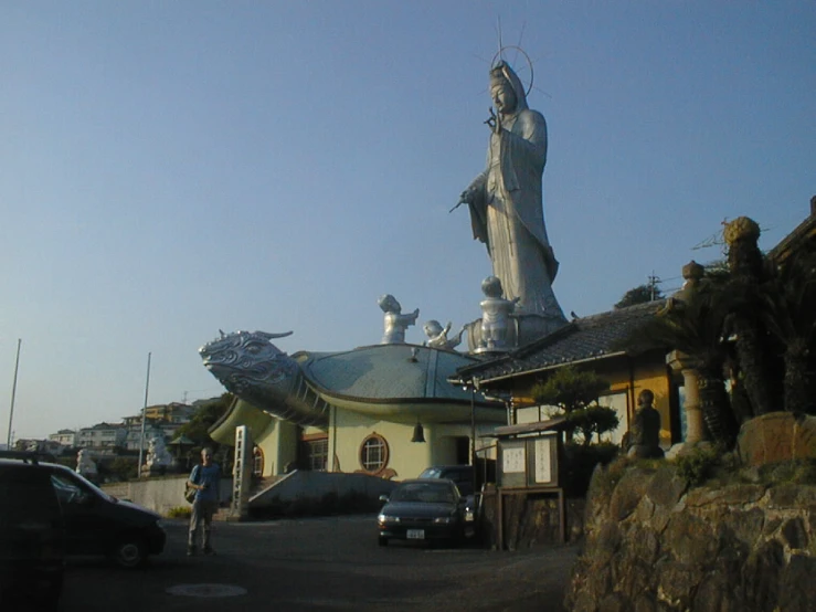 a building with a big statue on top of it