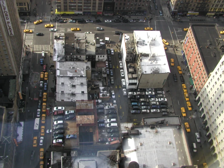 aerial view looking down on an urban street with cars