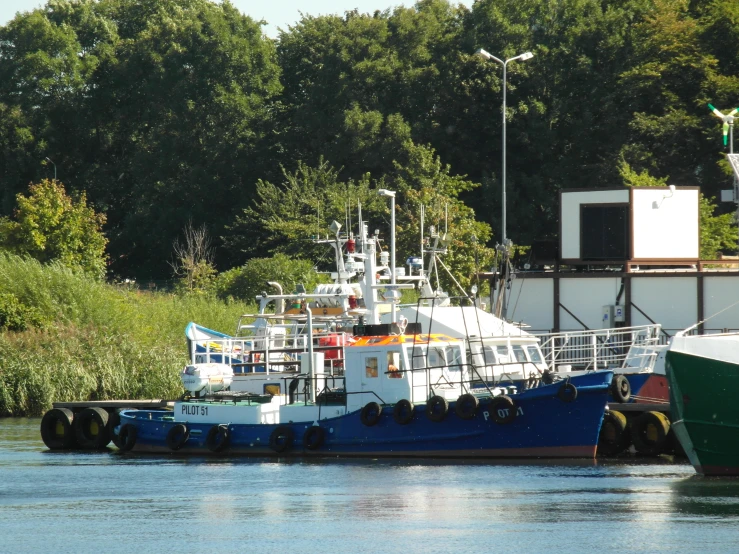 a small ship tied up to the dock