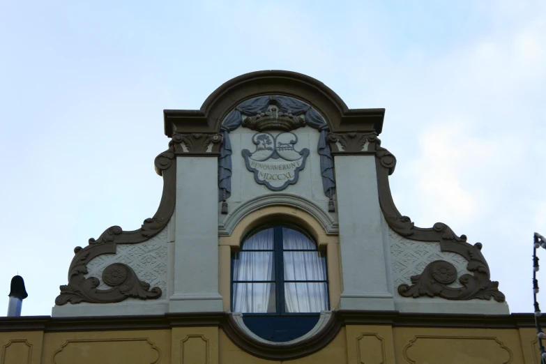 a close up of a building with a clock at the top