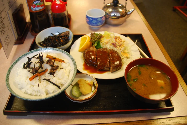 a meal set out on a black tray