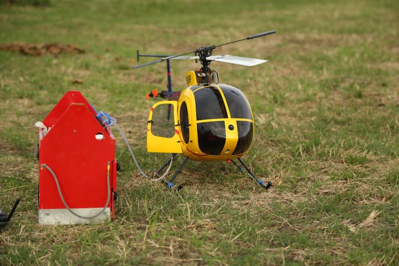 a toy helicopter set on top of the ground