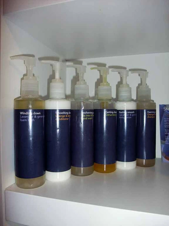 six bottle with soap and lotion bottles on a shelf