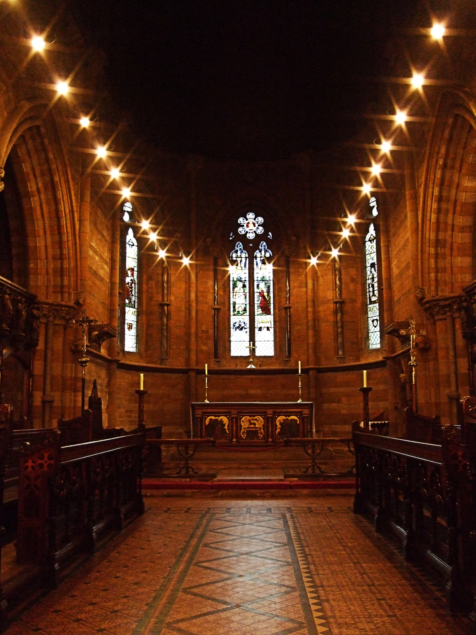 a cathedral with a massive stained glass window