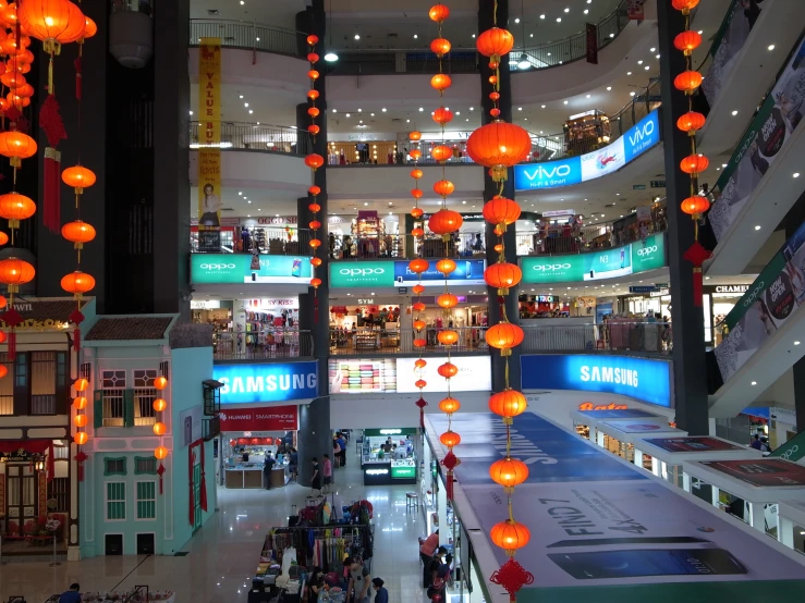 lights decorate the interior of a shopping mall