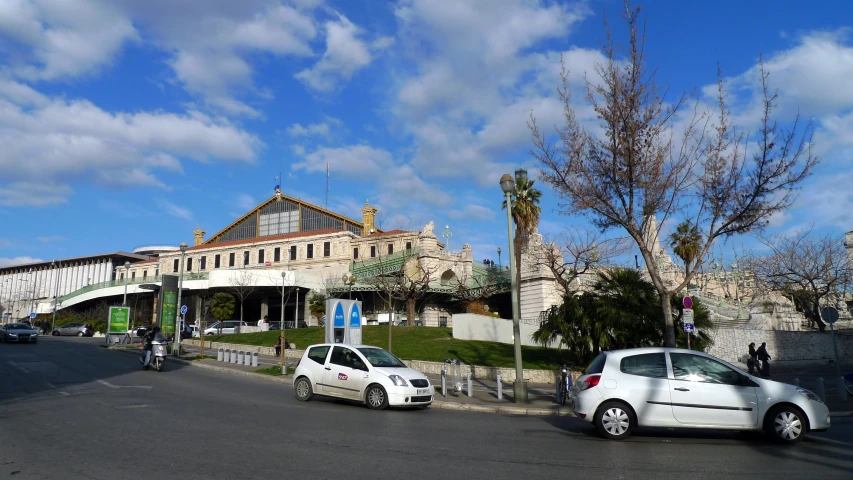 a street scene with a large building next to it