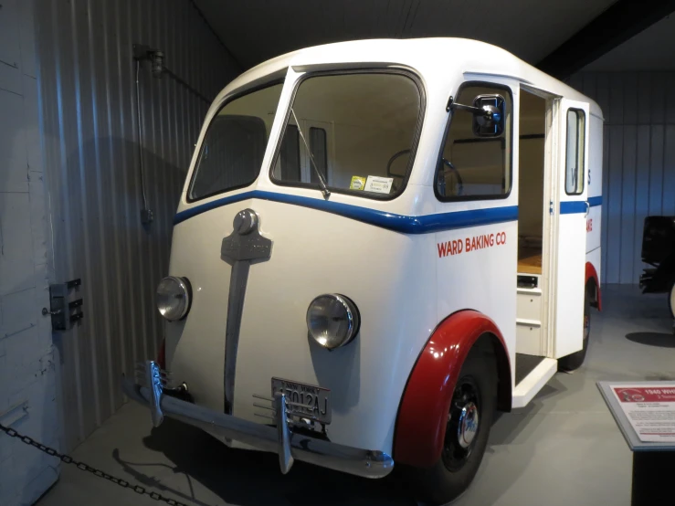 an old fashioned bus is shown in this museum