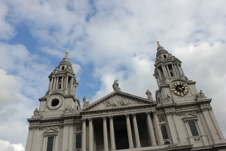 a large, ornate building with some very tall clocks on it