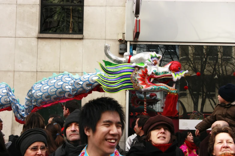 a dragon in the air above a crowd