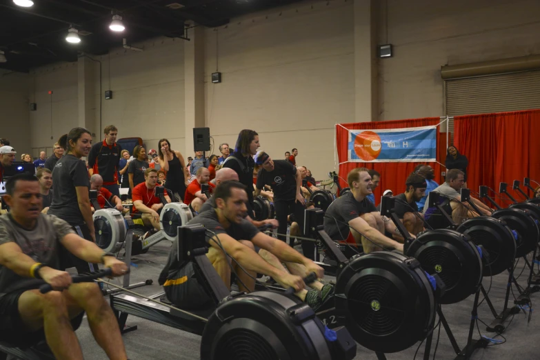 people sitting in exercise benches at the gym