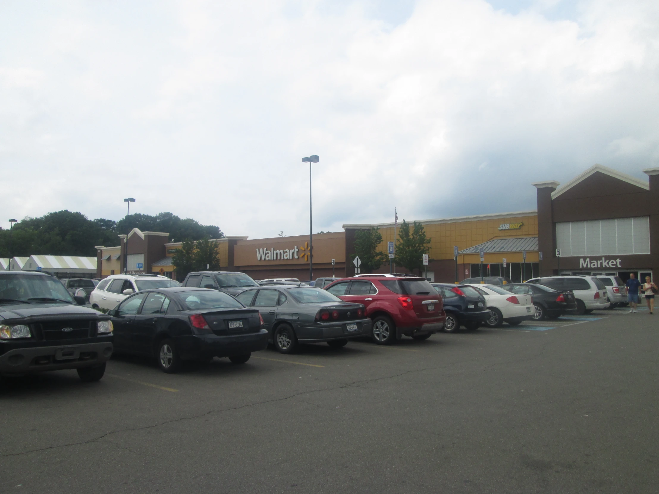 a parking lot full of cars and buildings