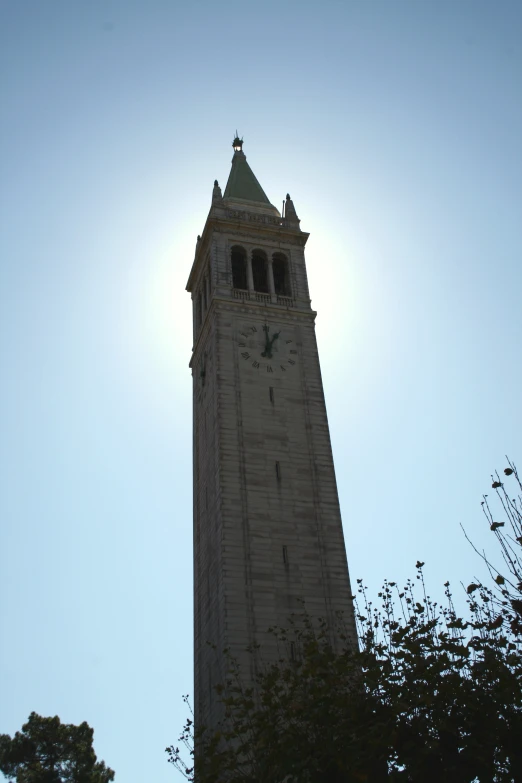 a tall tower with a clock on it's side