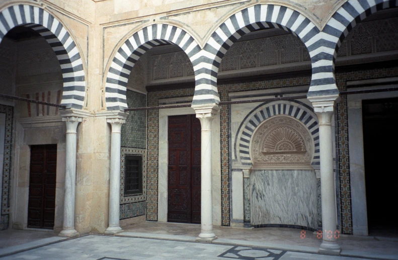 arches with a tiled door in a historical building