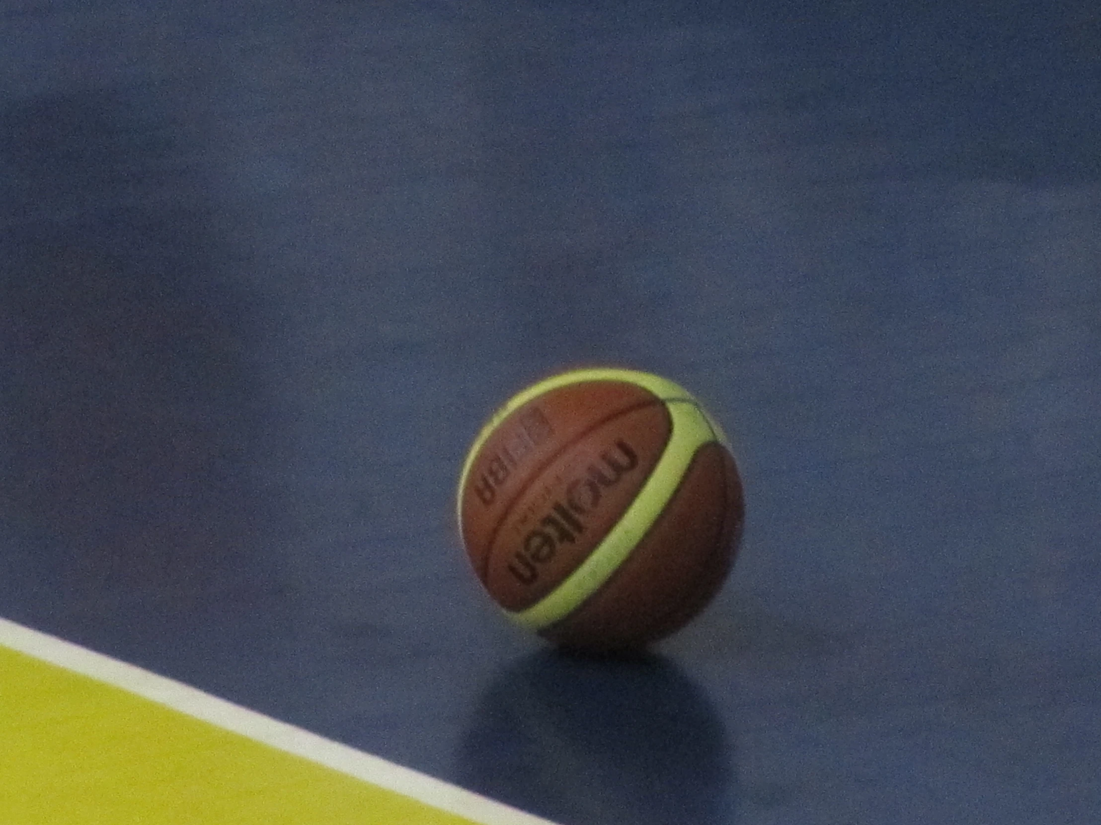 an basketball that is laying on a court