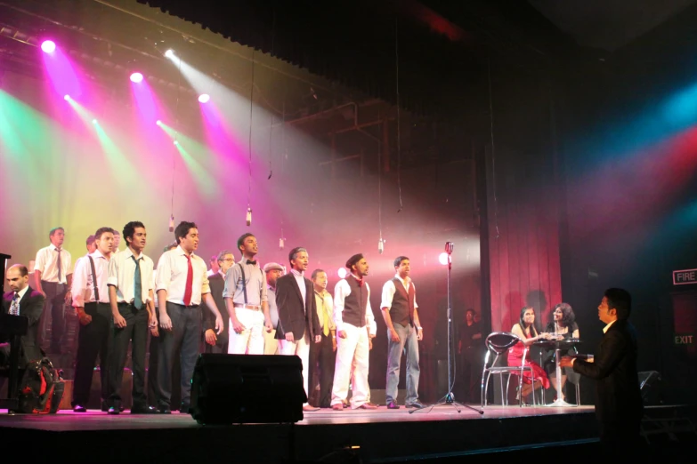 a group of people that are standing on a stage