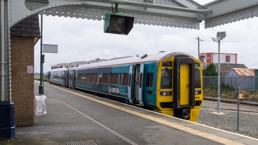 a train sits in the station as it passes through