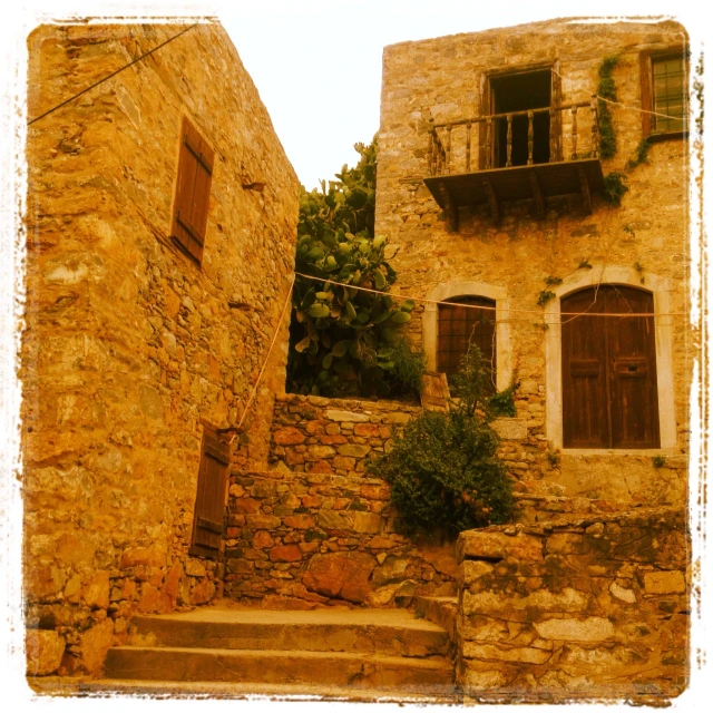 a stone building with a clock on the front