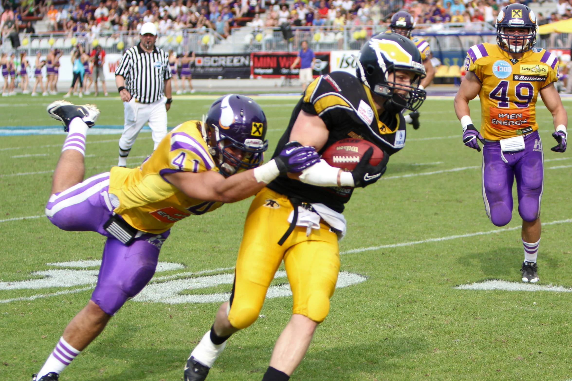 the football players are on the field playing football