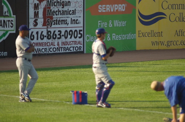 a team of baseball players standing on top of a field