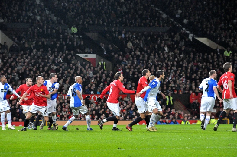 soccer players compete in a match on the field