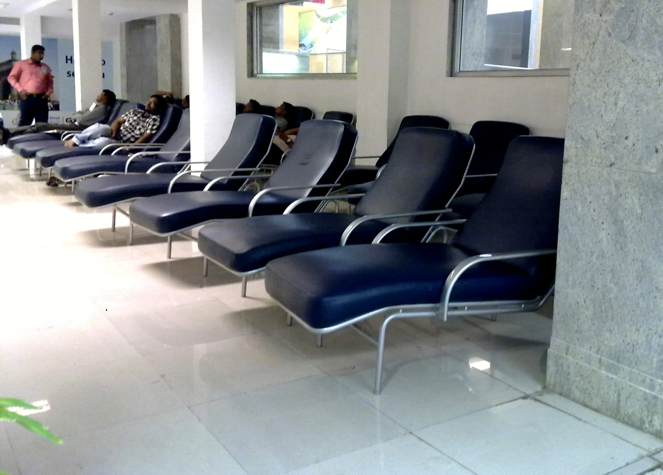 many chairs are lined up at the airport terminal