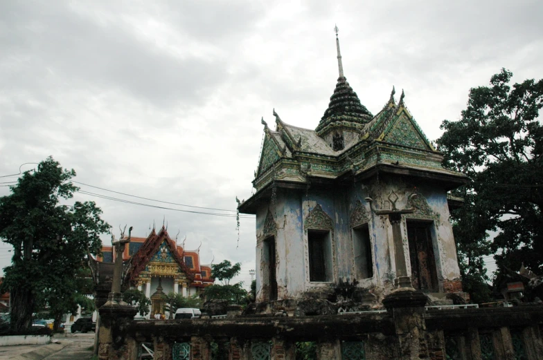 a building with intricate decorations on top in a city